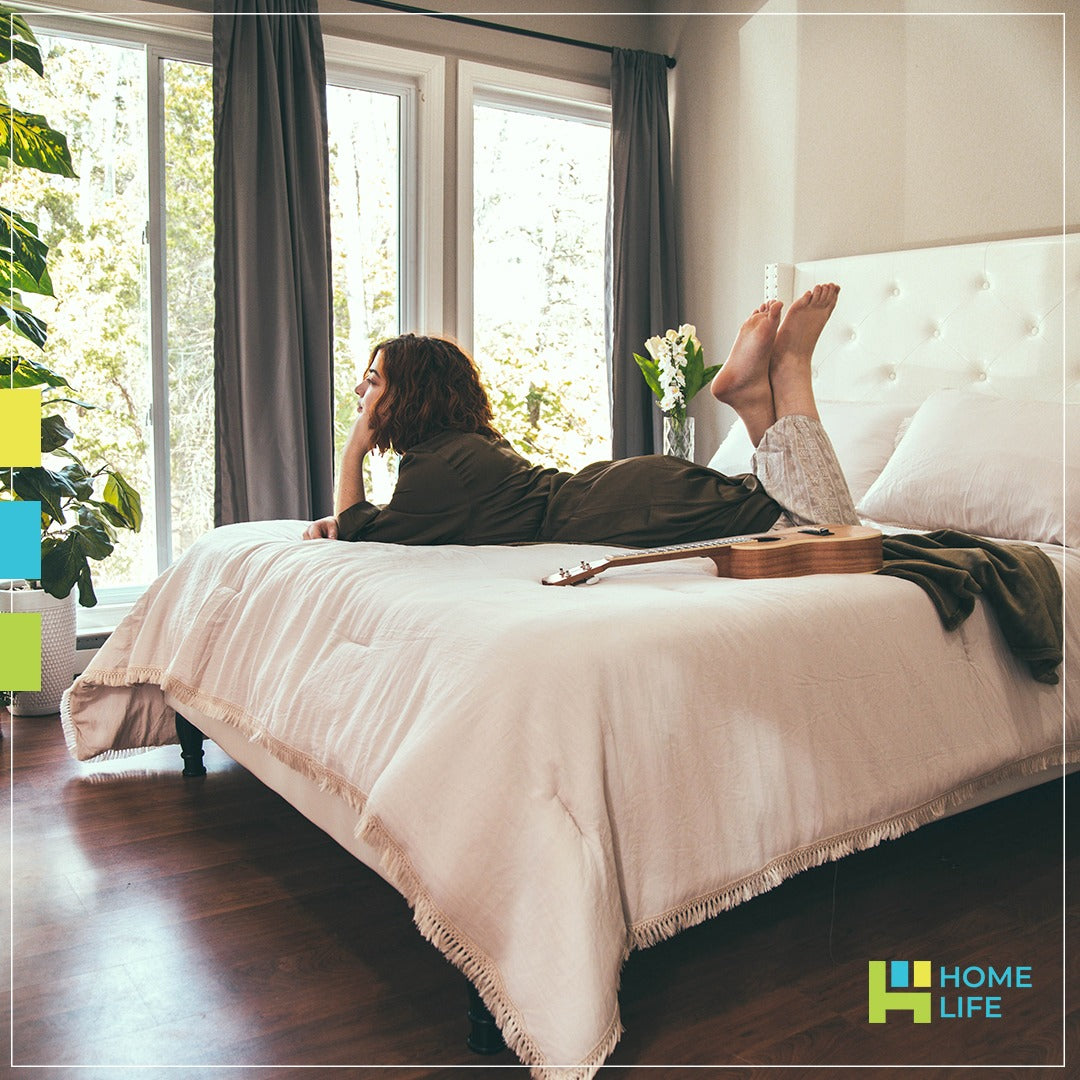 A girl relaxing on a bed.